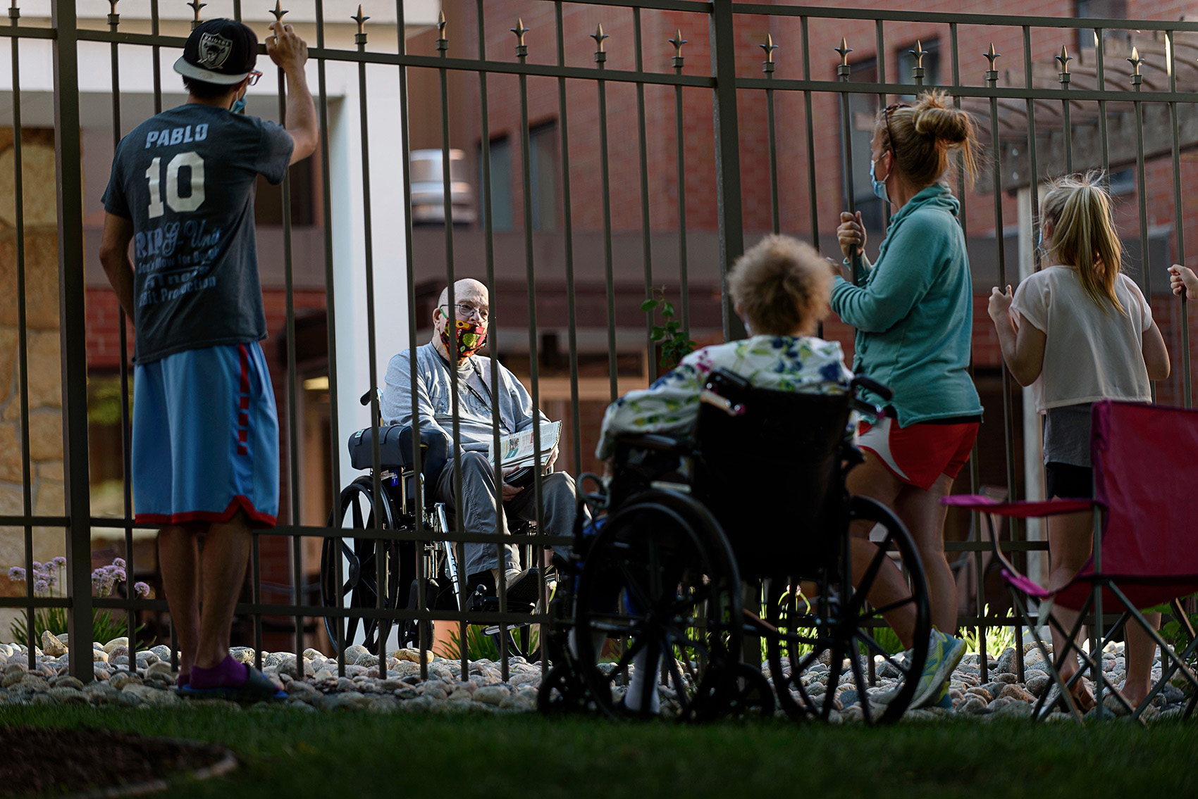 Photo of relatives visiting a nursing home resident taken by Fargo, North Dakota photojournalist Dan Koeck.