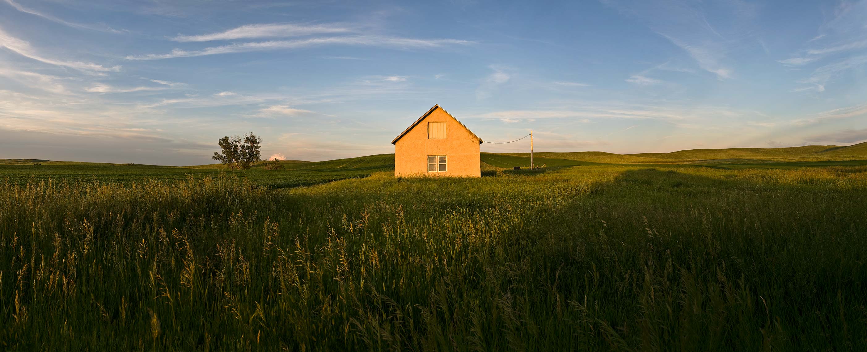 An abandoned farmhouse on the western North Dakota prairie, taken by North Dakota photogrpaher Dan Koeck